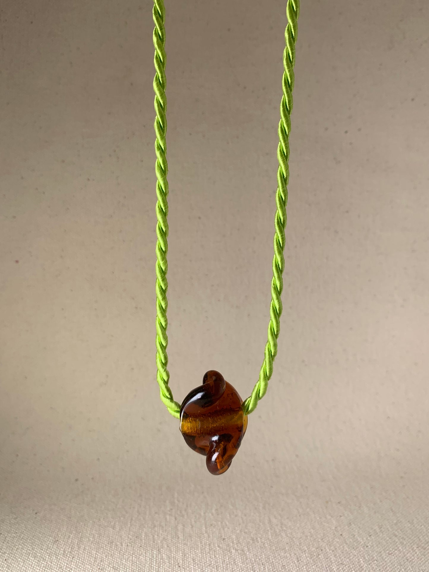 DEVOTEE TWIST NECKLACE, AMBER